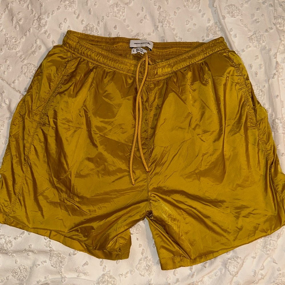 Yellow/gold athletic Urban Outfitters shorts.